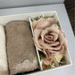 Box with bow with 2 washcloths and scented flower